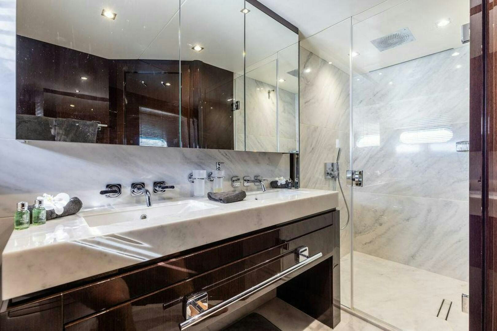 a kitchen with a large mirror aboard PURA VIDA Yacht for Sale