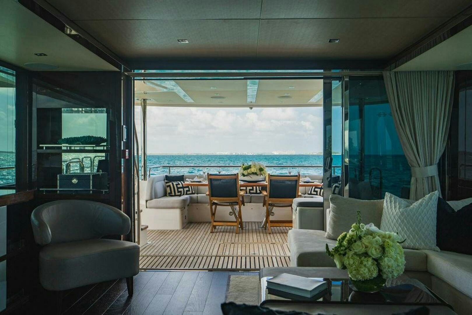 a room with a view of the ocean and the ocean aboard PURA VIDA Yacht for Sale