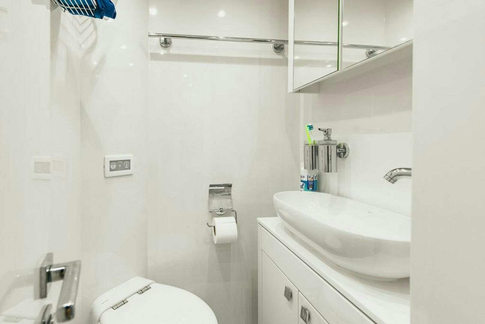 a bathroom with a sink and a mirror aboard PURA VIDA Yacht for Sale