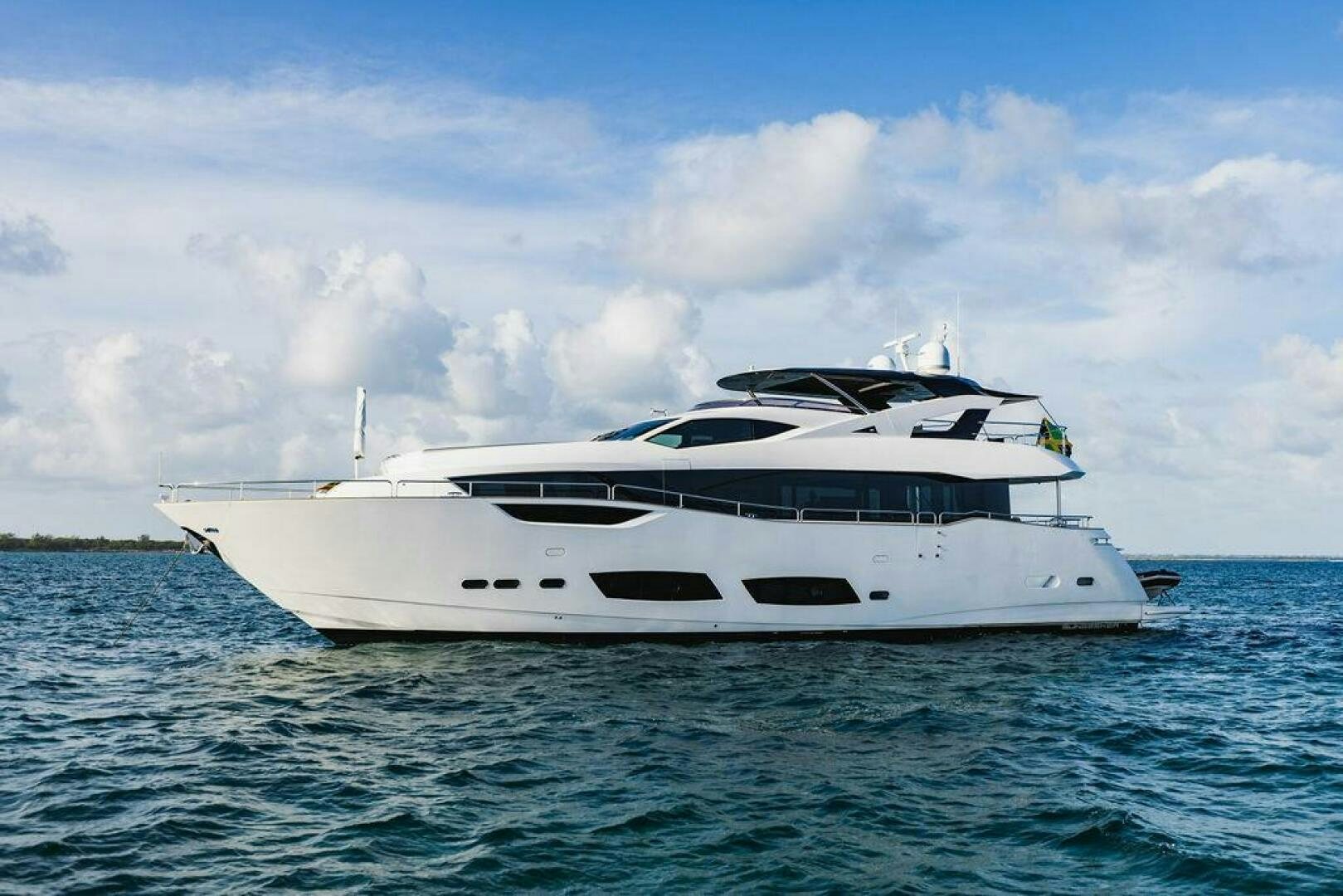 a white yacht in the water aboard PURA VIDA Yacht for Sale