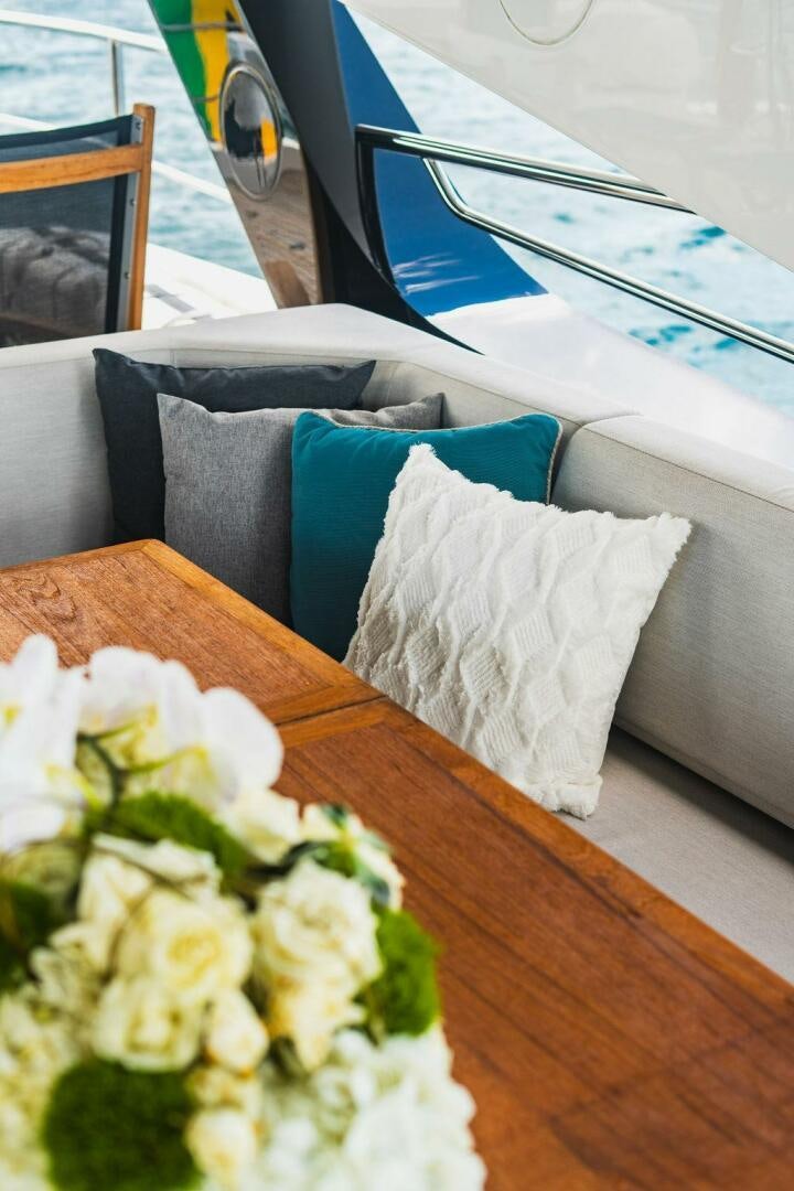 a white flower bouquet on a table aboard PURA VIDA Yacht for Sale