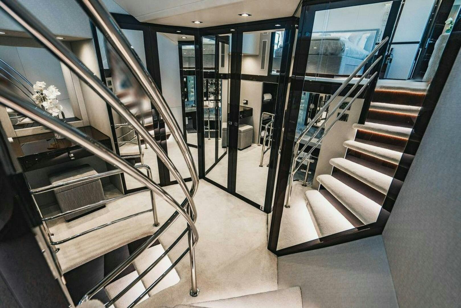 a hallway with glass doors aboard PURA VIDA Yacht for Sale