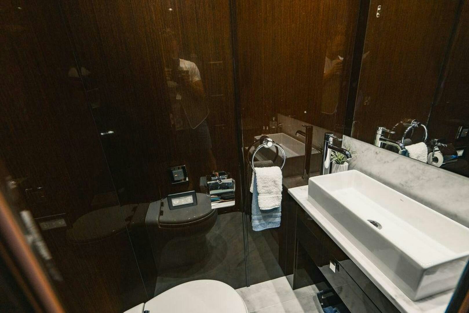 a bathroom with a tub sink and toilet aboard PURA VIDA Yacht for Sale