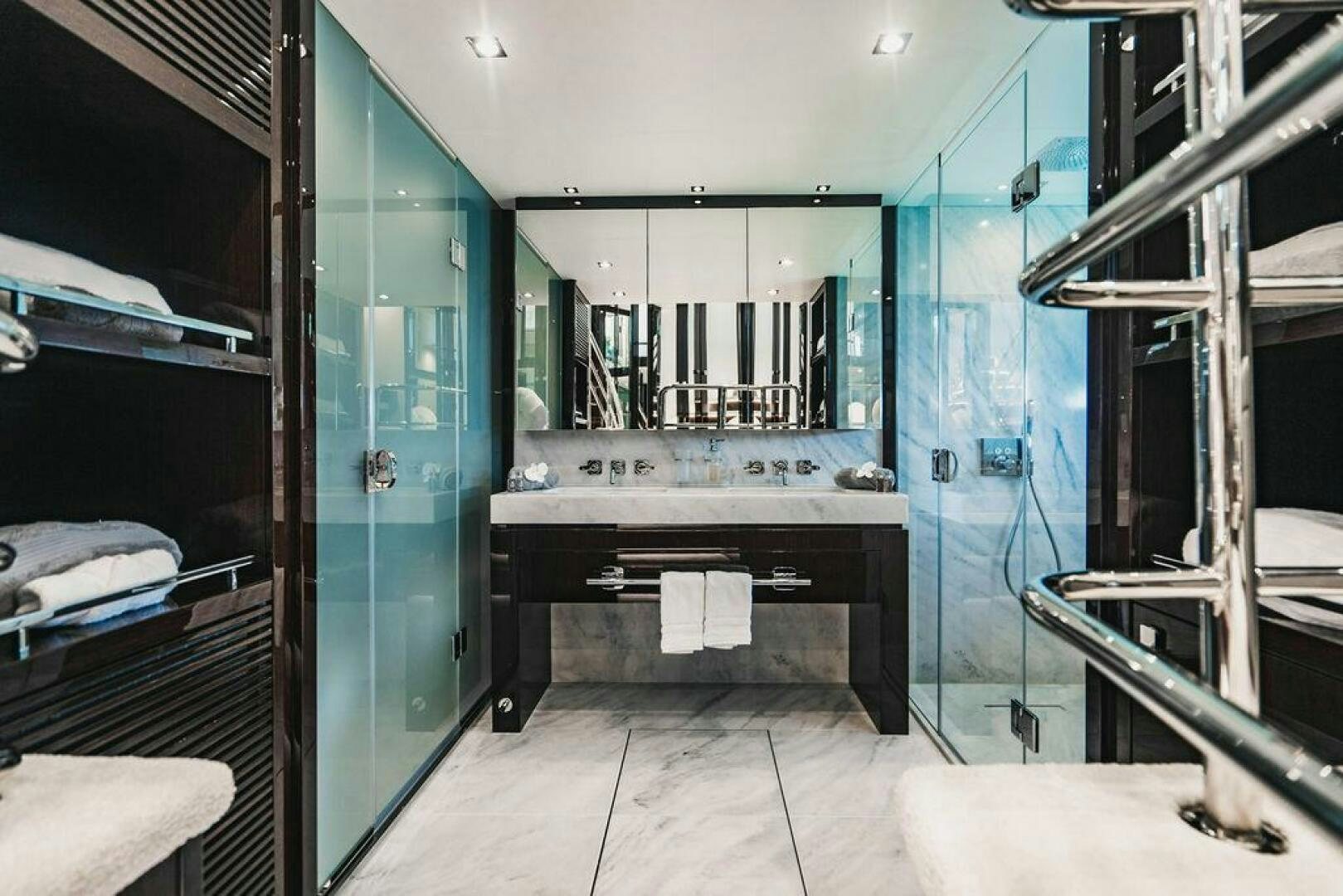 a bathroom with a sink and a mirror aboard PURA VIDA Yacht for Sale