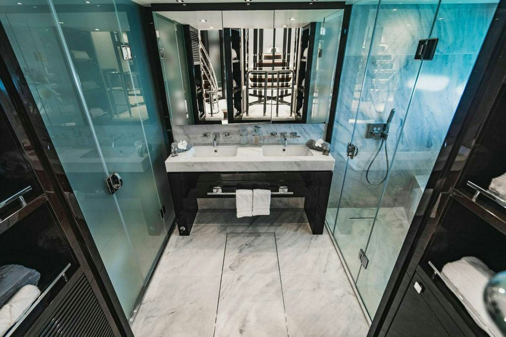 a bathroom with a glass shower aboard PURA VIDA Yacht for Sale