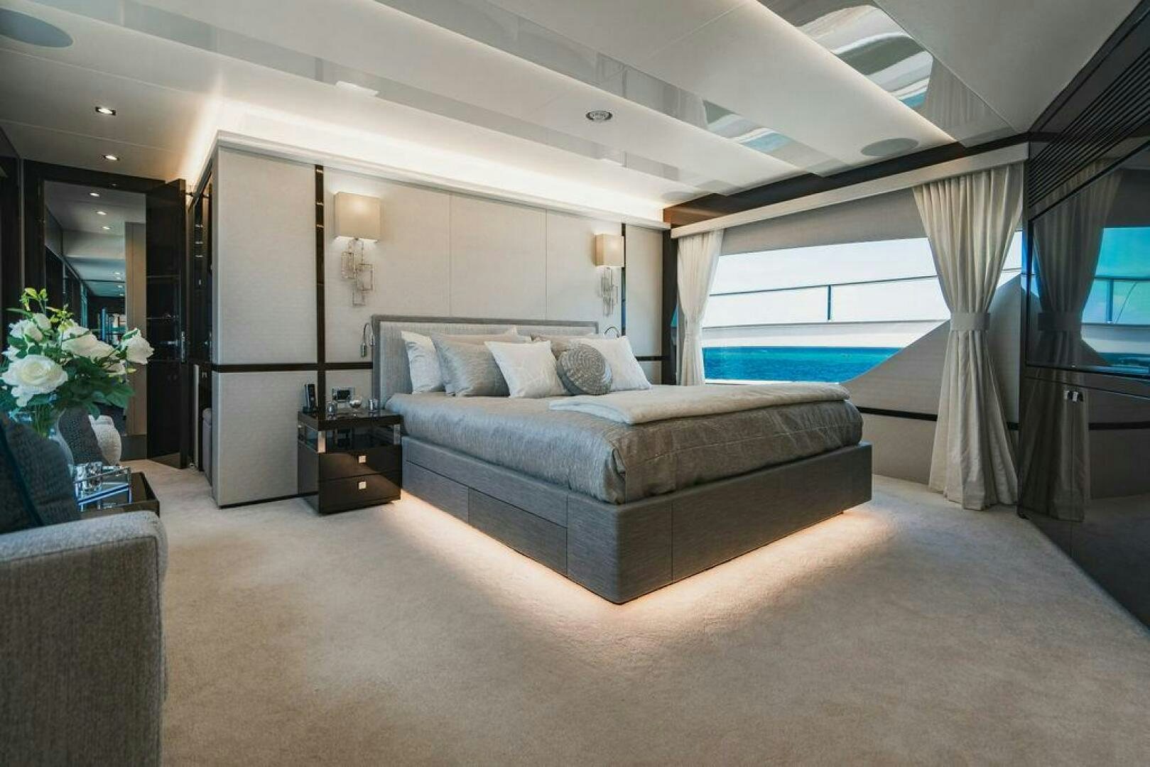 a large bedroom with a large bed aboard PURA VIDA Yacht for Sale
