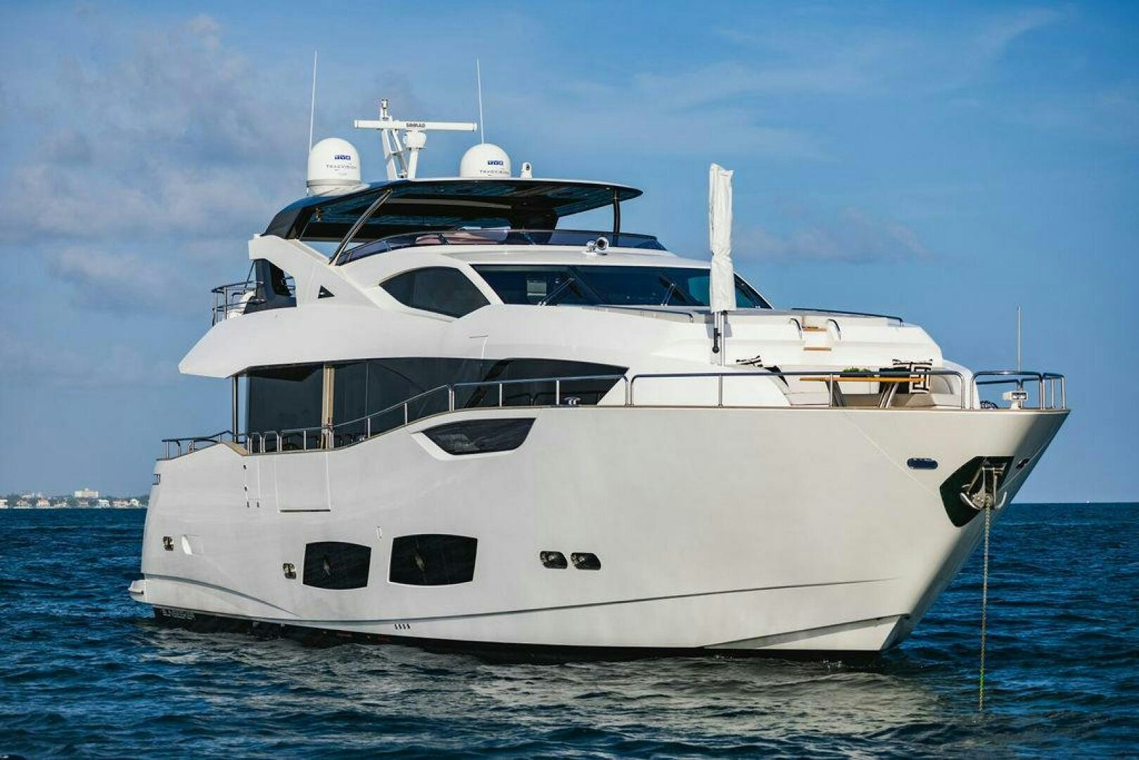 a white yacht in the water aboard PURA VIDA Yacht for Sale