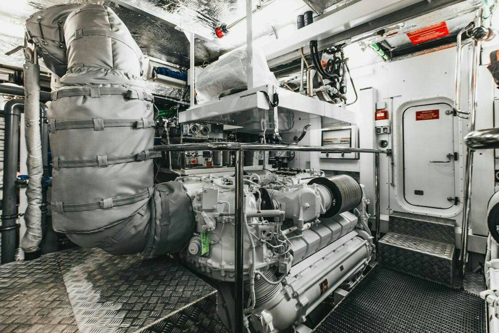 a vehicle with a large stack of tires and a large bag on the back aboard PURA VIDA Yacht for Sale