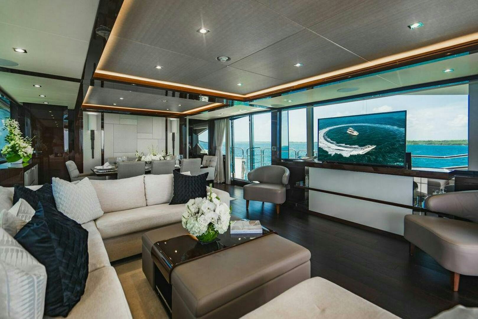 a living room with a large window aboard PURA VIDA Yacht for Sale