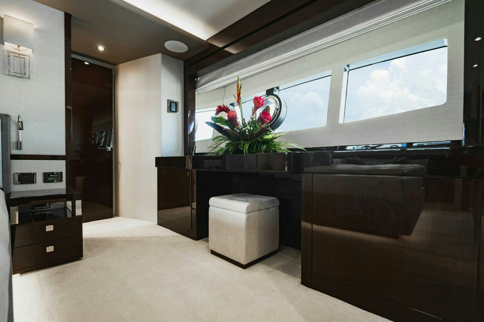 a room with a large desk and a tv aboard PURA VIDA Yacht for Sale