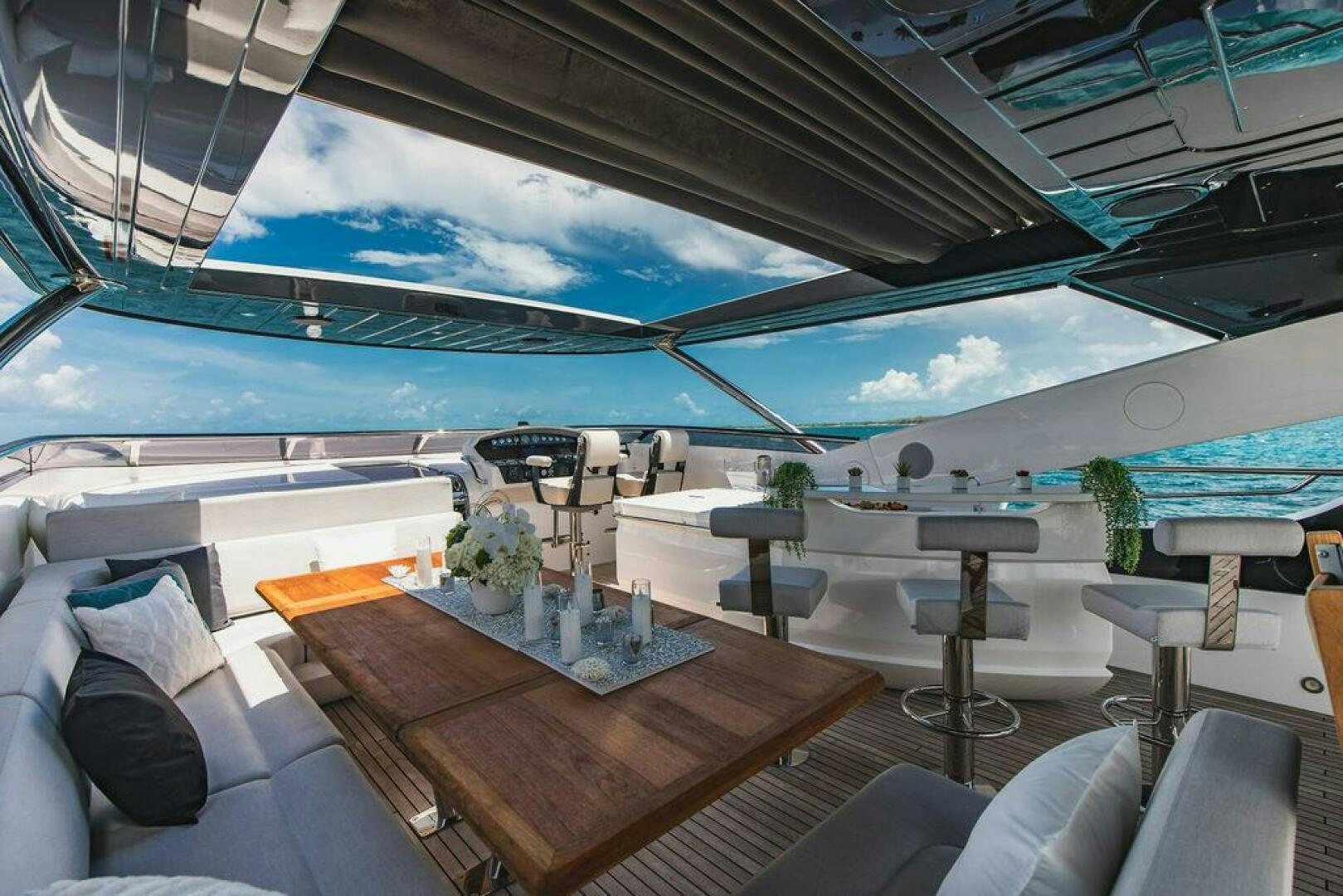 a room with a table and chairs aboard PURA VIDA Yacht for Sale