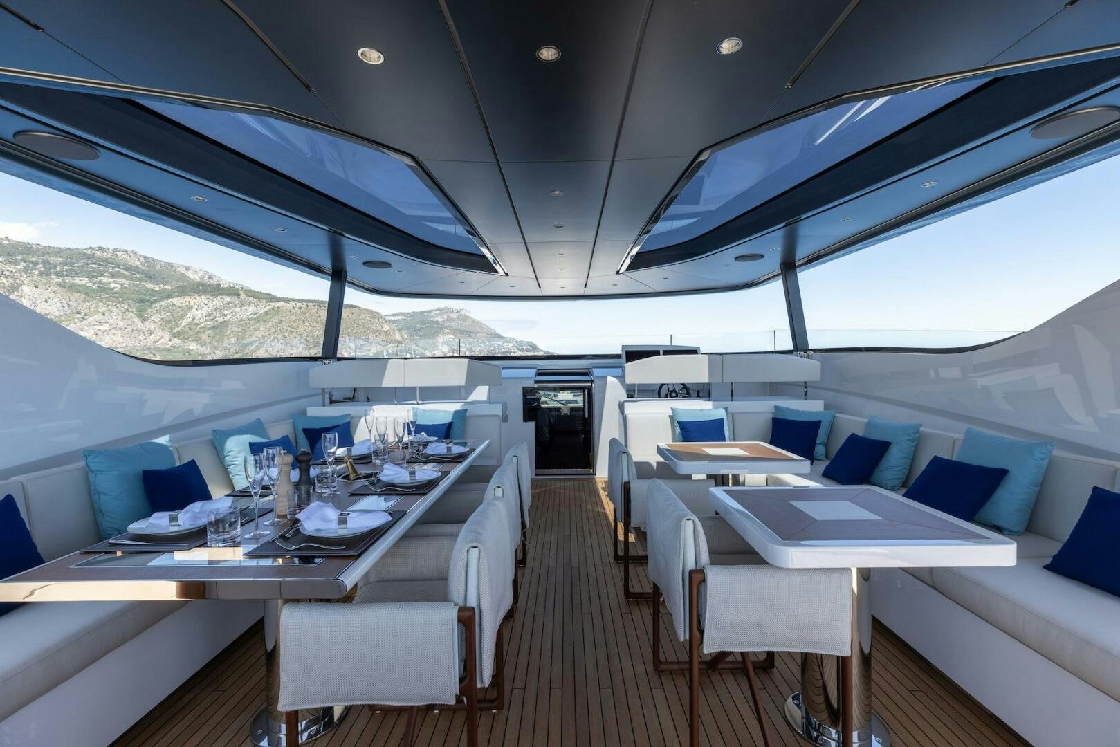 a large room with tables and chairs aboard ARTEMIS Yacht for Sale