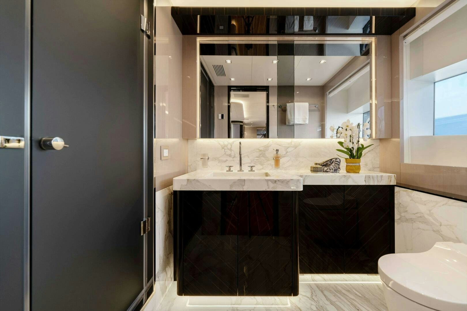 a bathroom with a sink and cabinets aboard ARTEMIS Yacht for Sale