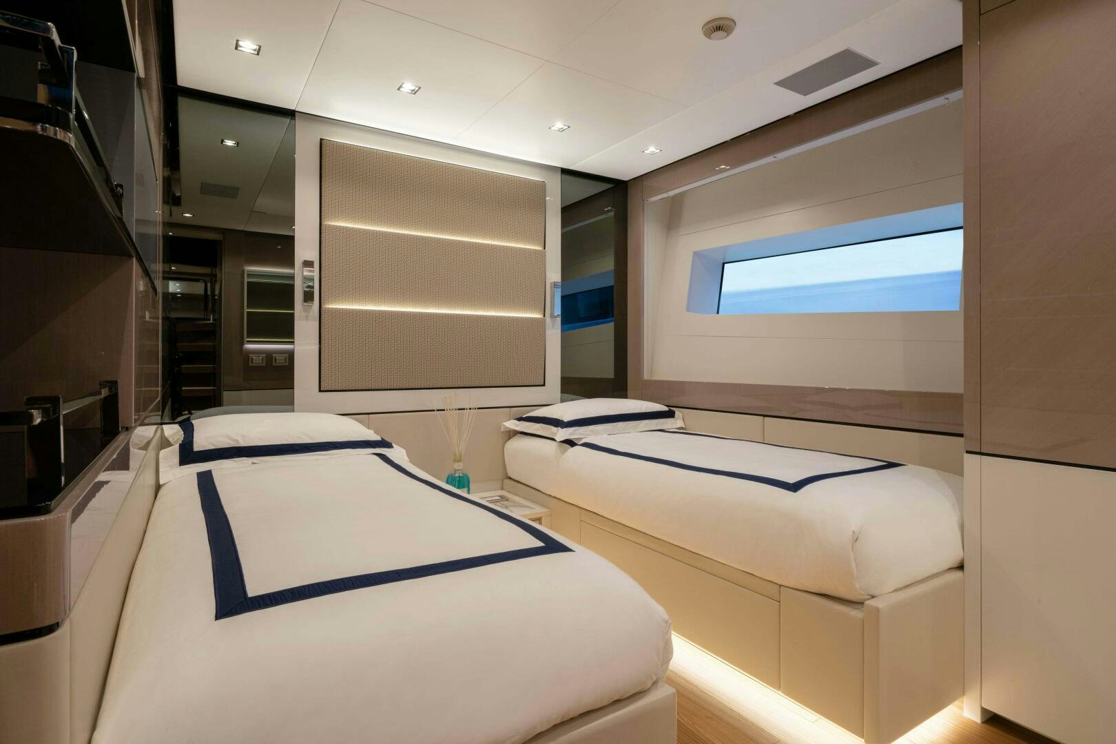 a room with a bed and a window aboard ARTEMIS Yacht for Sale