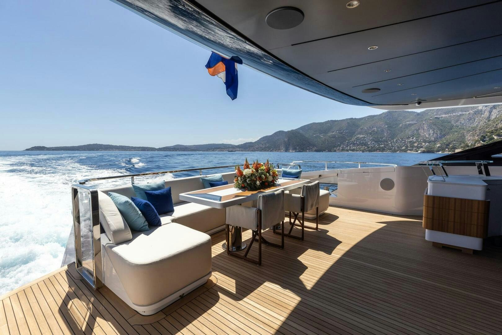 a balcony with a table and chairs aboard ARTEMIS Yacht for Sale