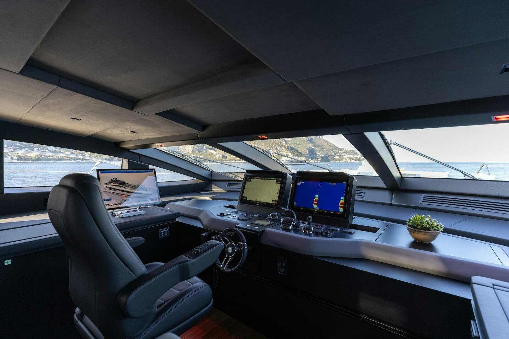 a car with multiple monitors aboard ARTEMIS Yacht for Sale