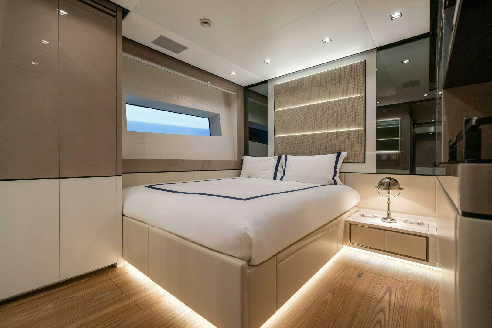 a room with a bed and a desk aboard ARTEMIS Yacht for Sale