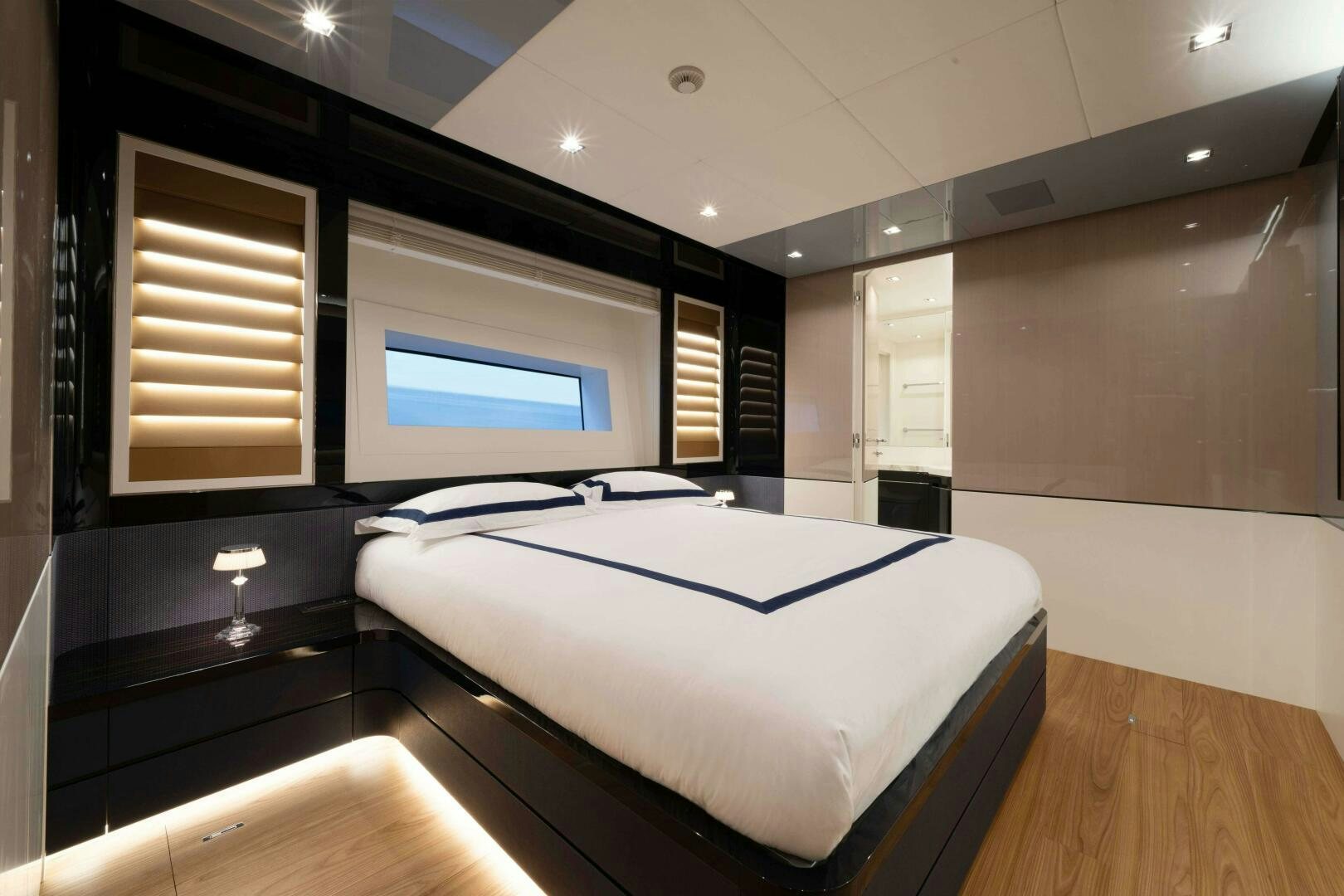 a large bedroom with a large mirror aboard ARTEMIS Yacht for Sale