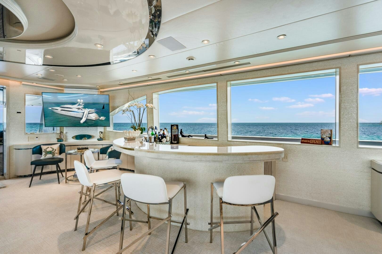 a room with tables and chairs aboard CUPCAKE Yacht for Sale