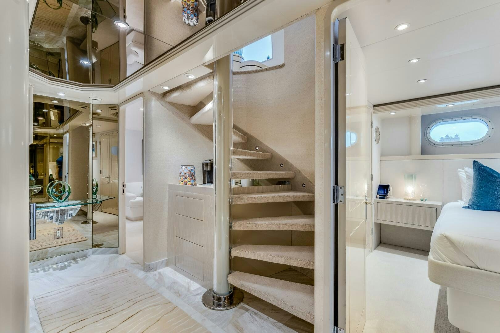 a modern looking room with a staircase aboard CUPCAKE Yacht for Sale