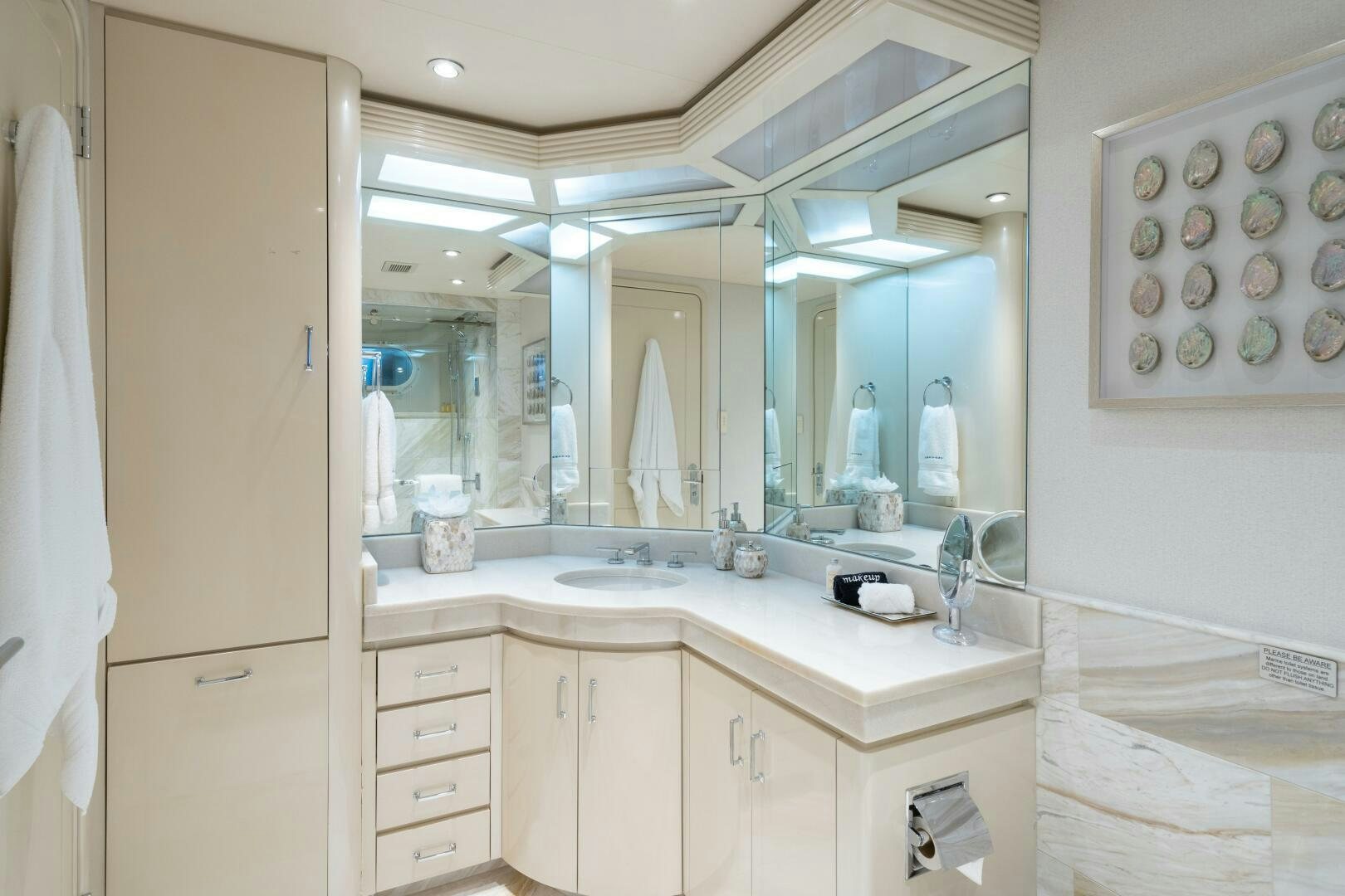 a bathroom with a large mirror aboard CUPCAKE Yacht for Sale