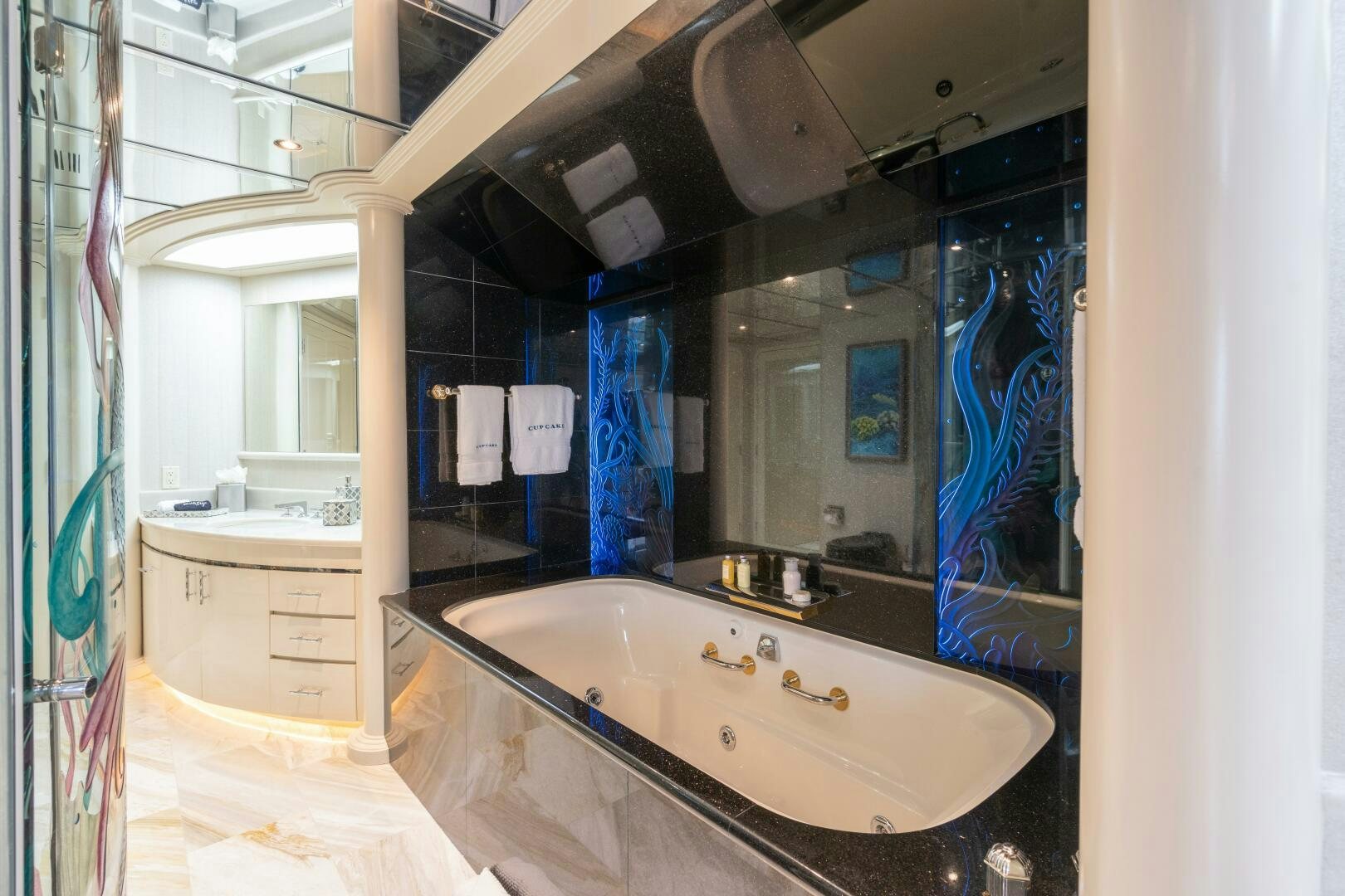 a bathroom with a large tub aboard CUPCAKE Yacht for Sale