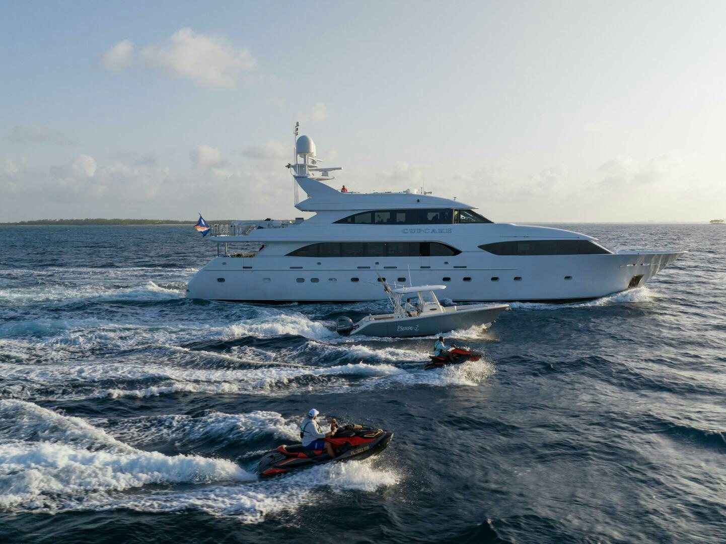 a boat in the water with a boat in the water aboard CUPCAKE Yacht for Sale