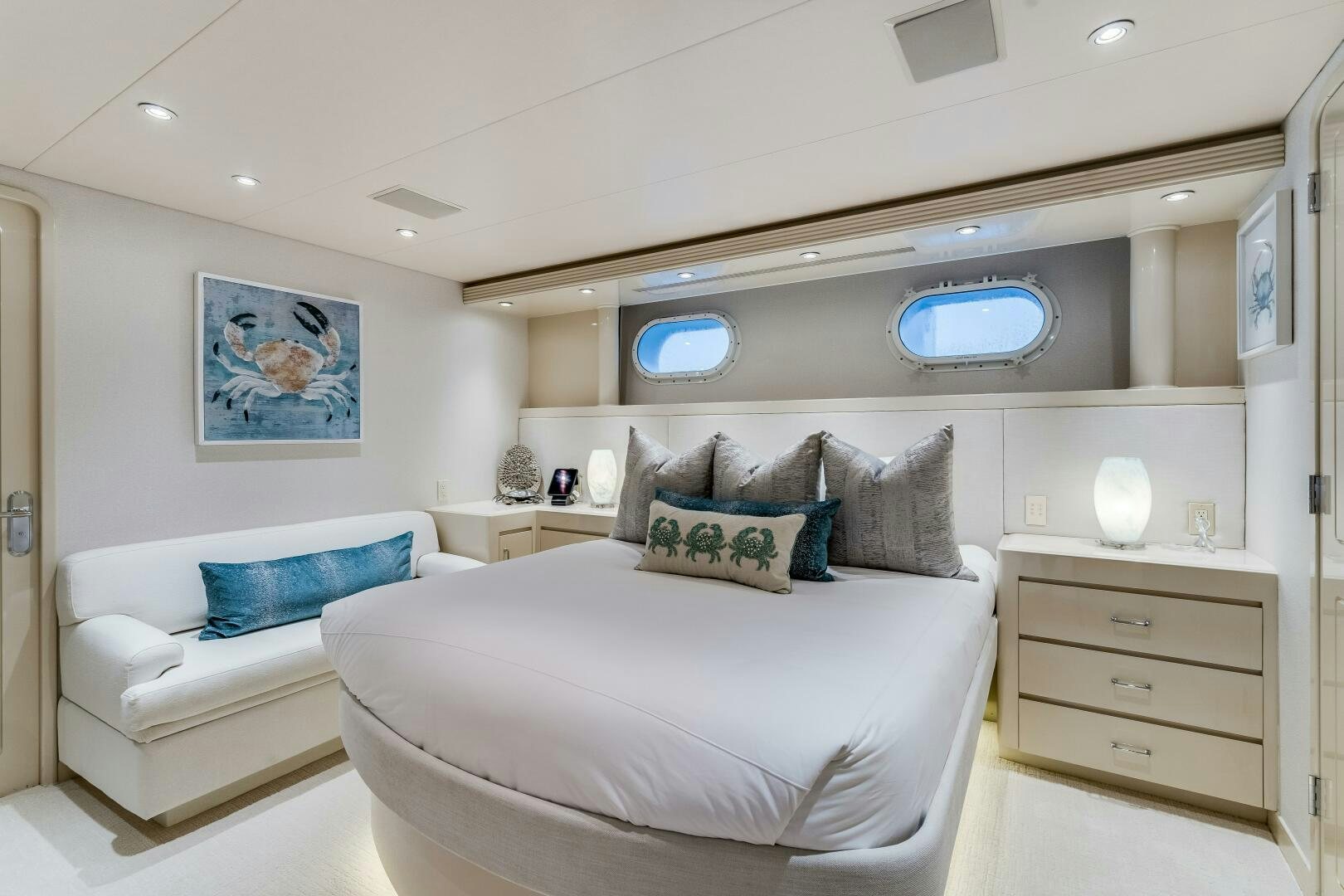 a room with a bed and a couch aboard CUPCAKE Yacht for Sale