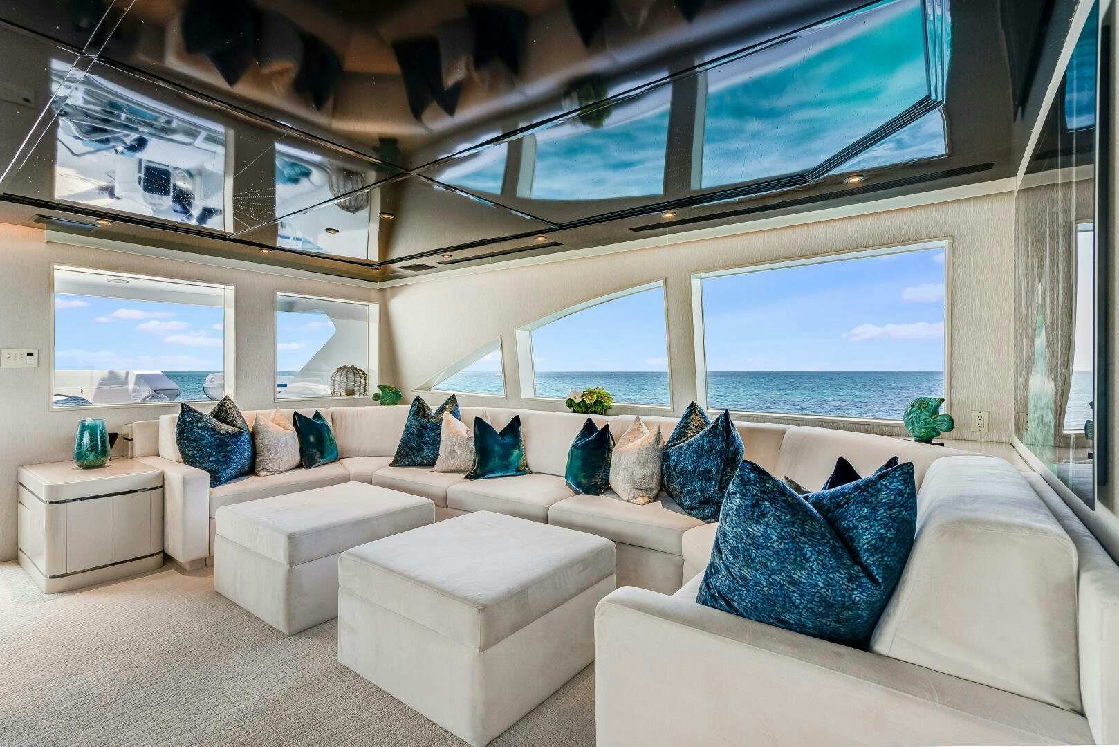 a living room with a large window aboard CUPCAKE Yacht for Sale