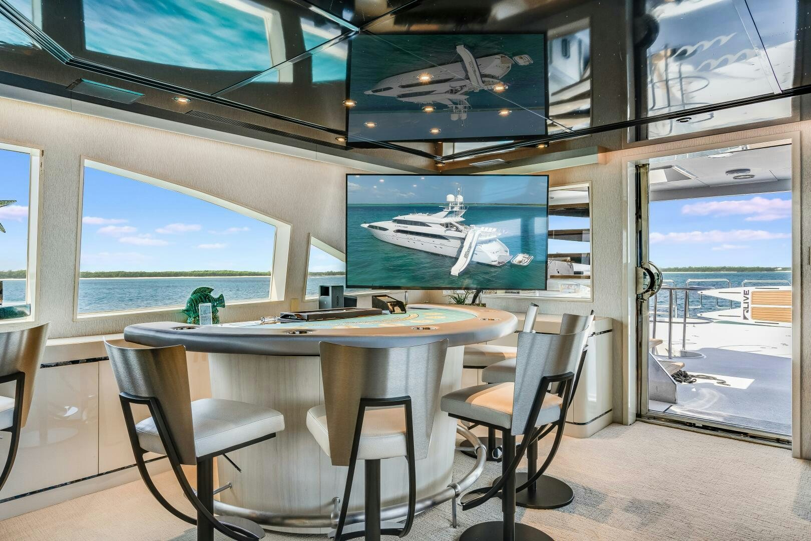 a room with a table and chairs aboard CUPCAKE Yacht for Sale