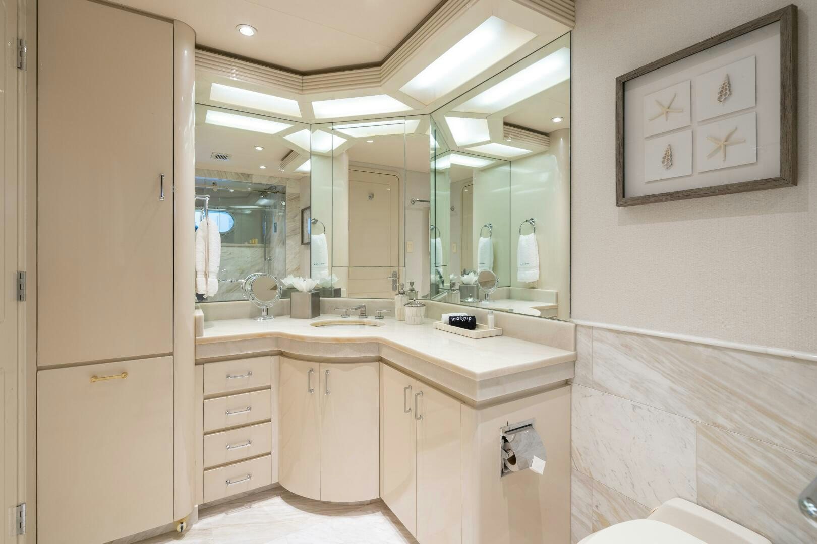 a bathroom with a large mirror aboard CUPCAKE Yacht for Sale