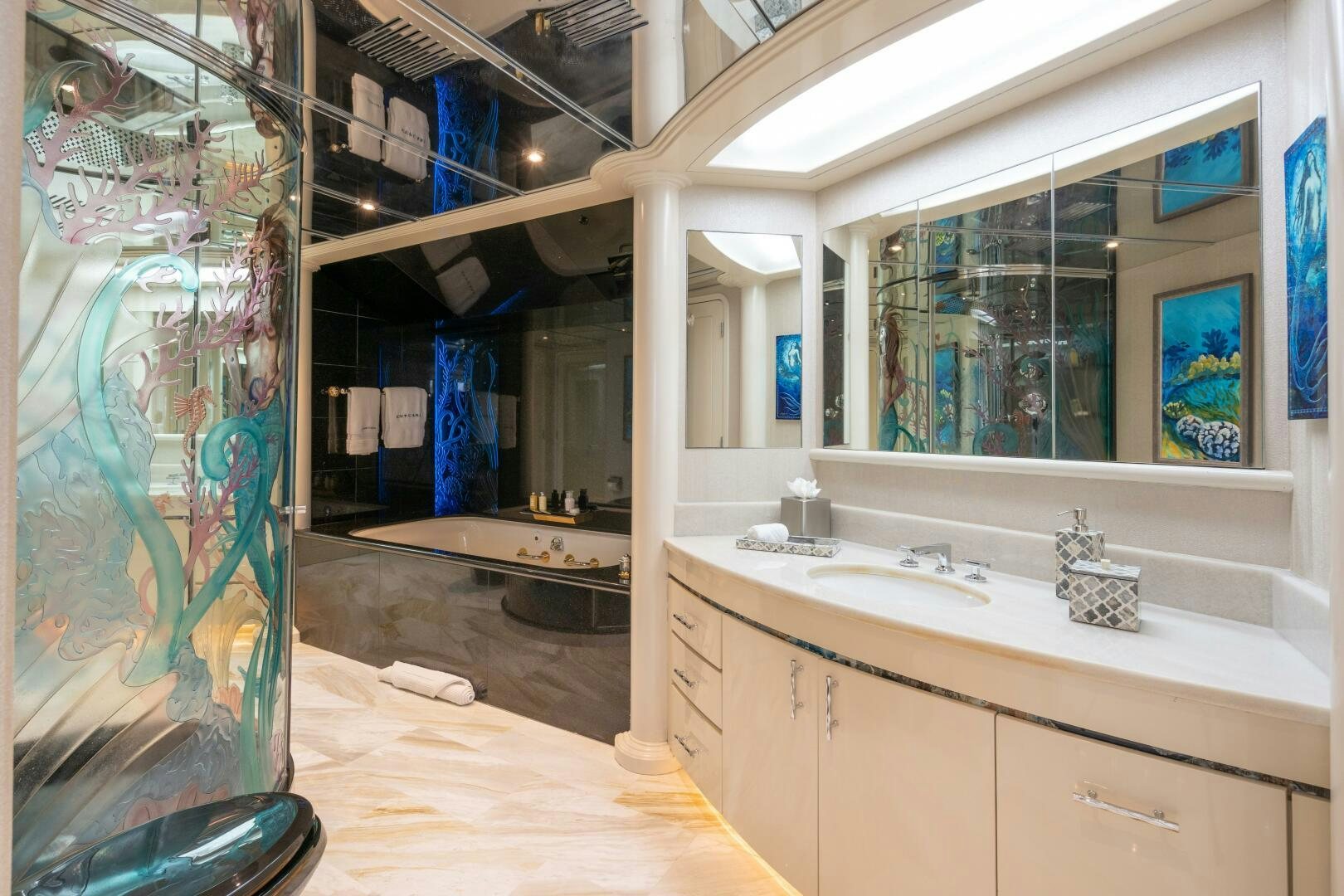 a bathroom with a large mirror aboard CUPCAKE Yacht for Sale