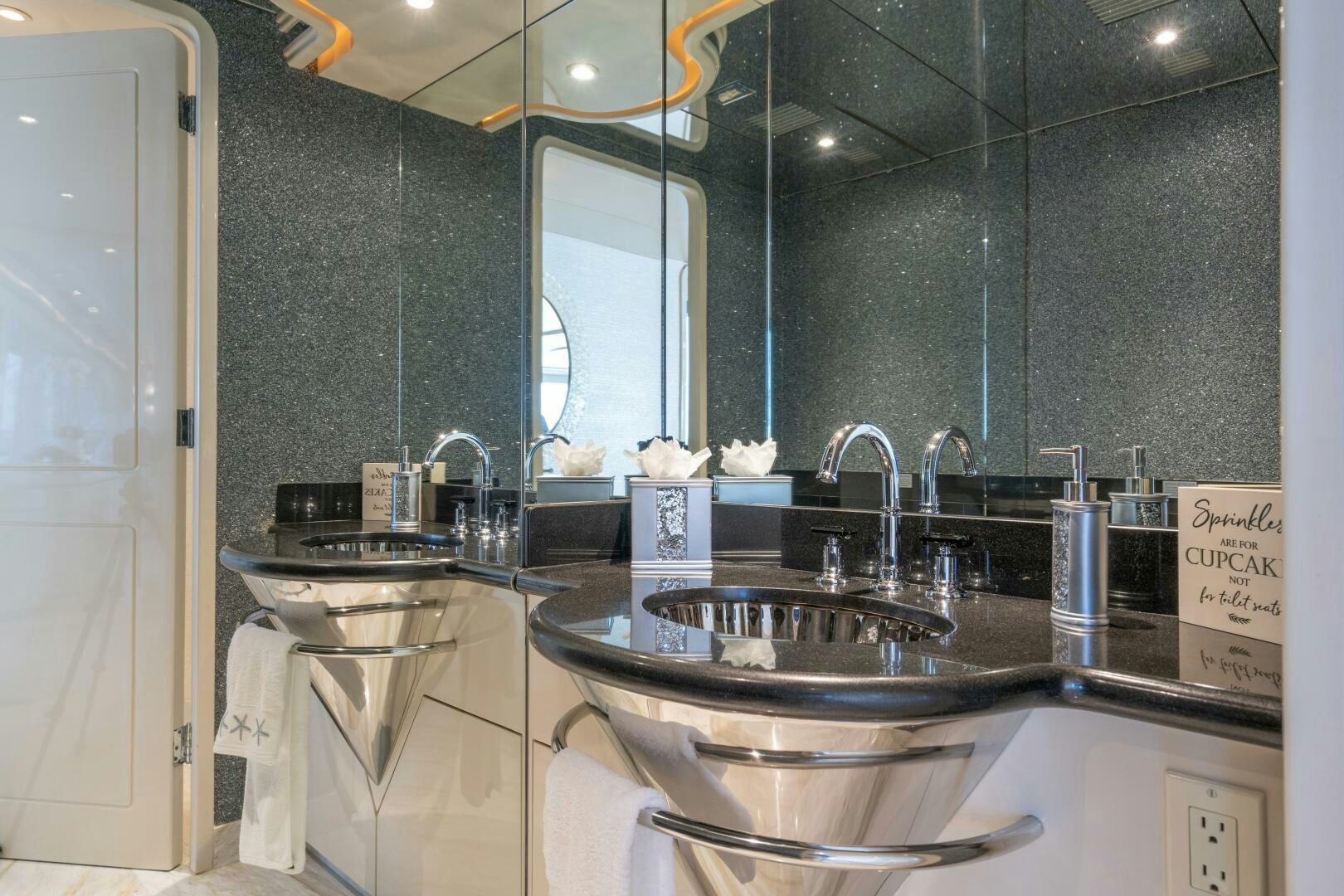 a kitchen with a sink and a mirror aboard CUPCAKE Yacht for Sale