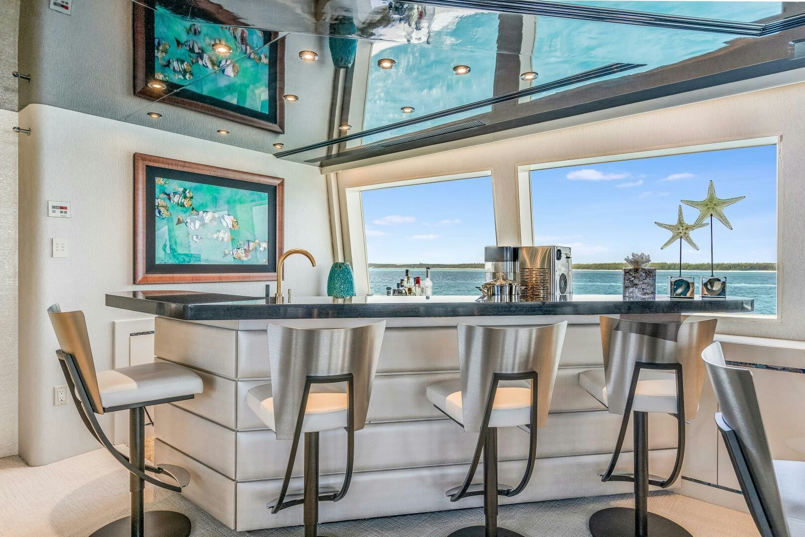 a room with a table and chairs aboard CUPCAKE Yacht for Sale
