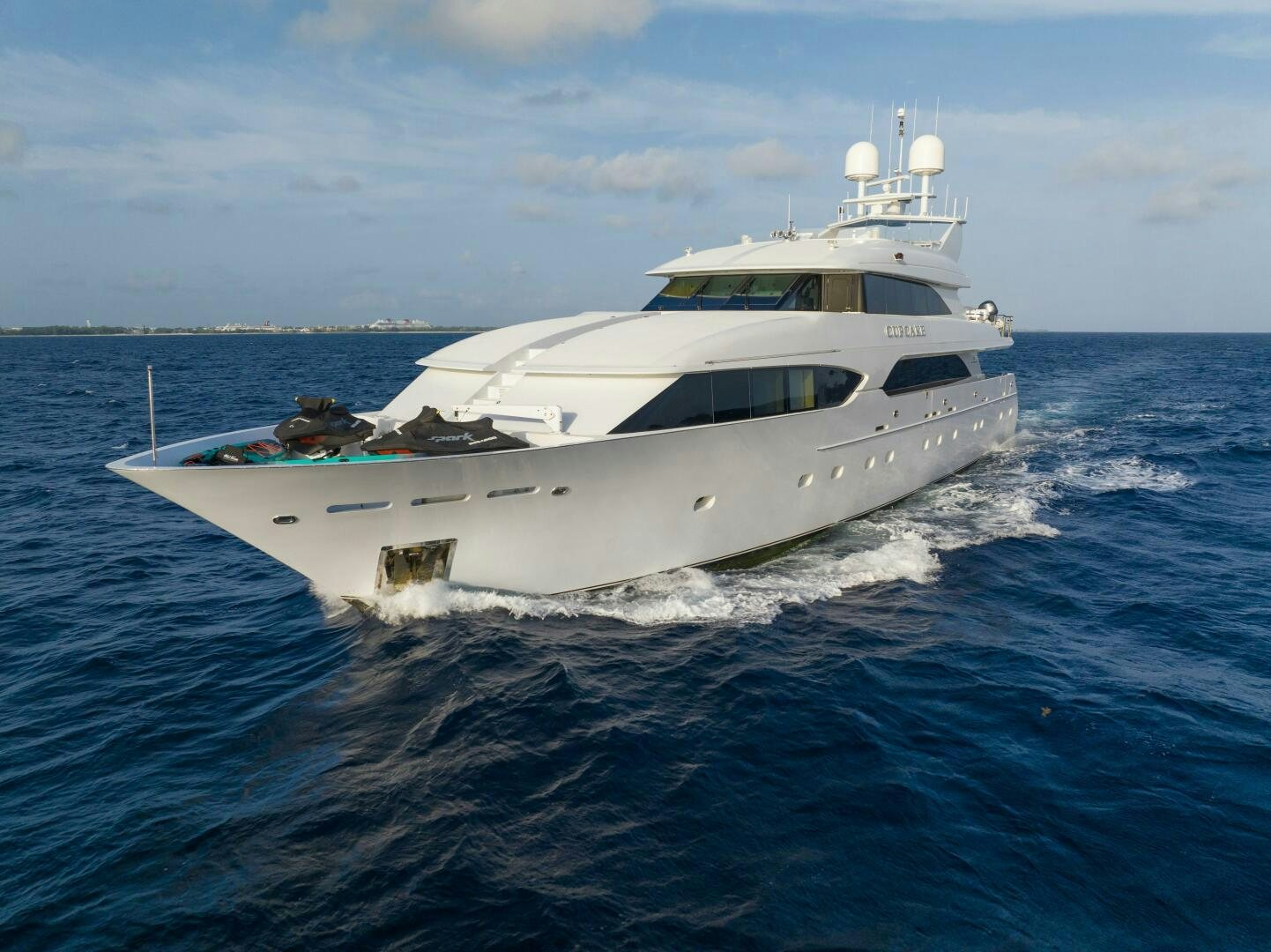 a white yacht in the water aboard CUPCAKE Yacht for Sale