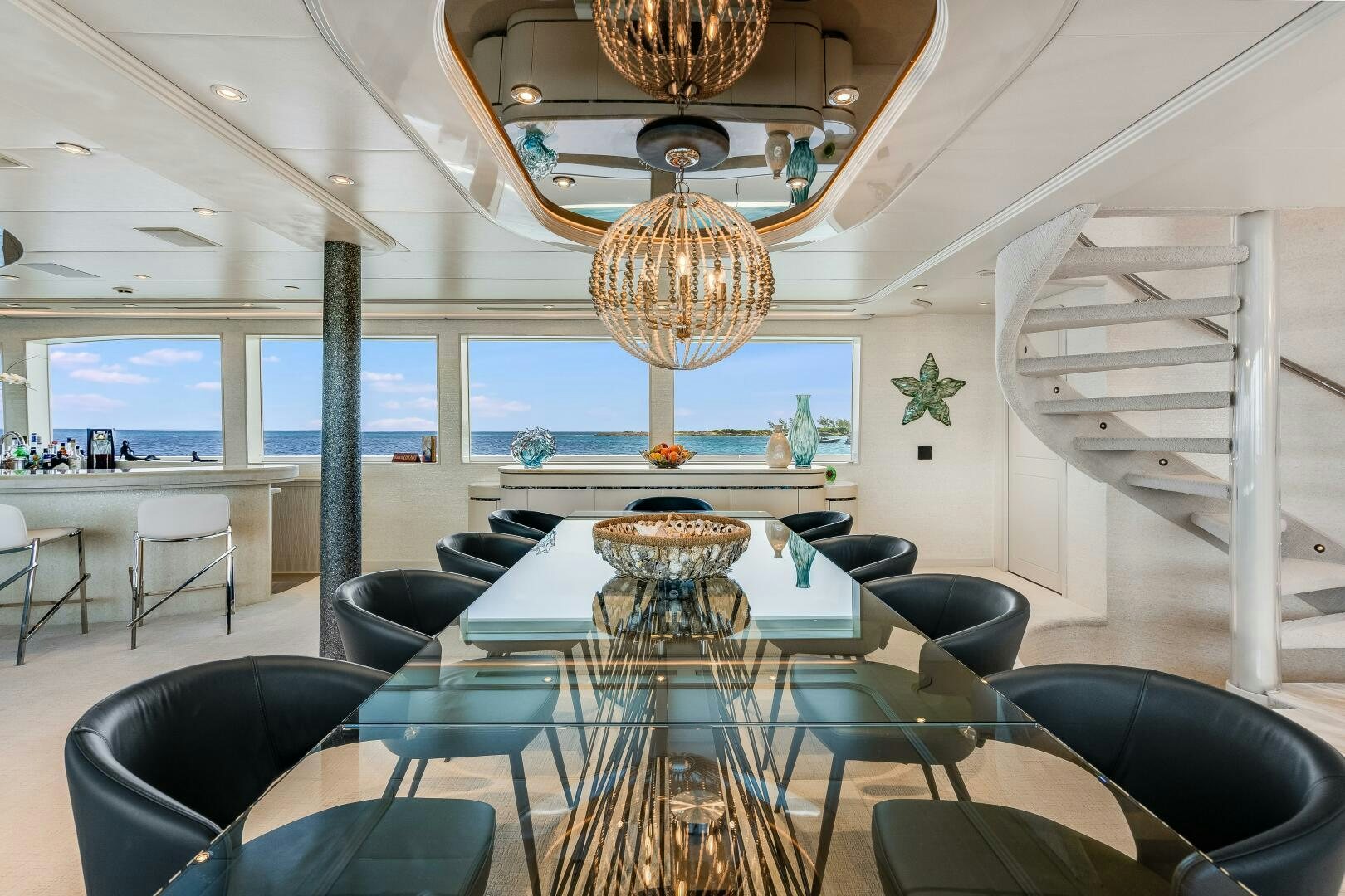 a room with a table and chairs aboard CUPCAKE Yacht for Sale