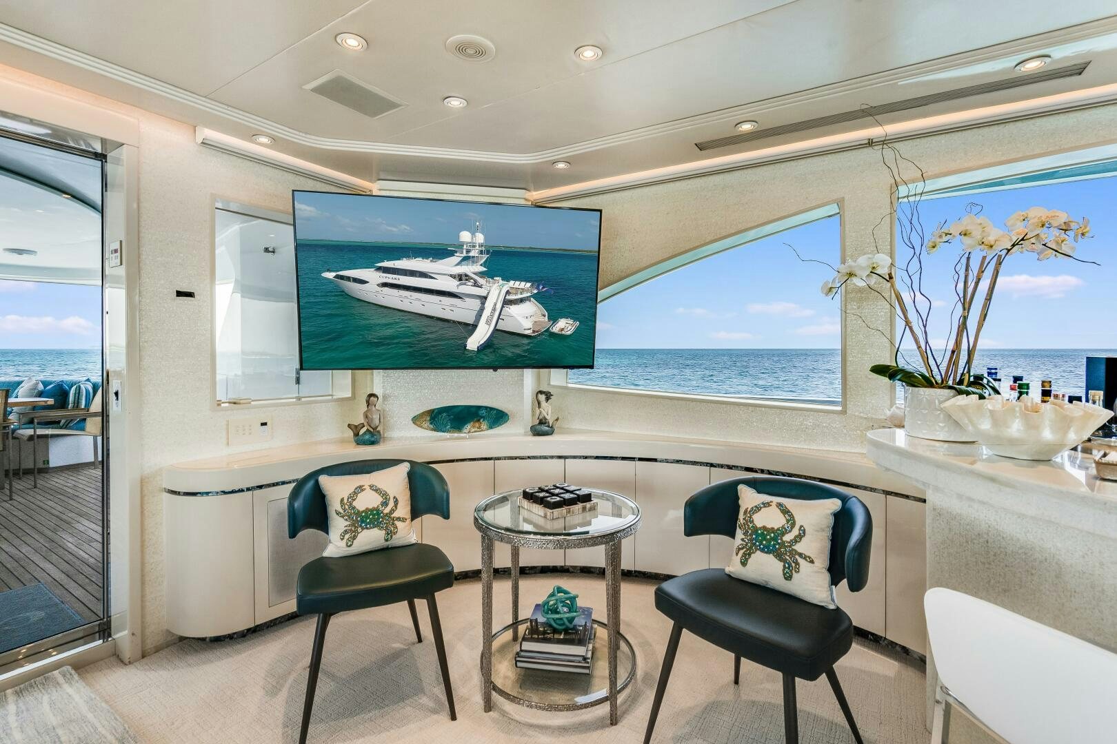 a room with a table and chairs aboard CUPCAKE Yacht for Sale