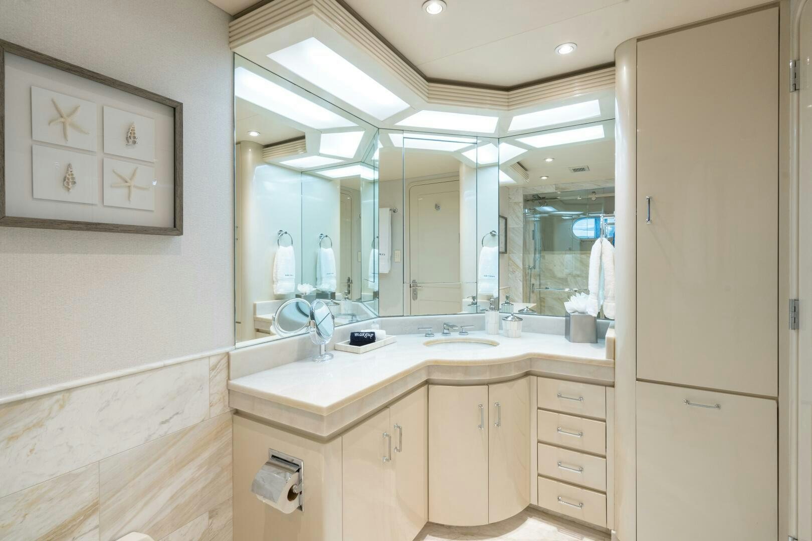a bathroom with a large mirror aboard CUPCAKE Yacht for Sale