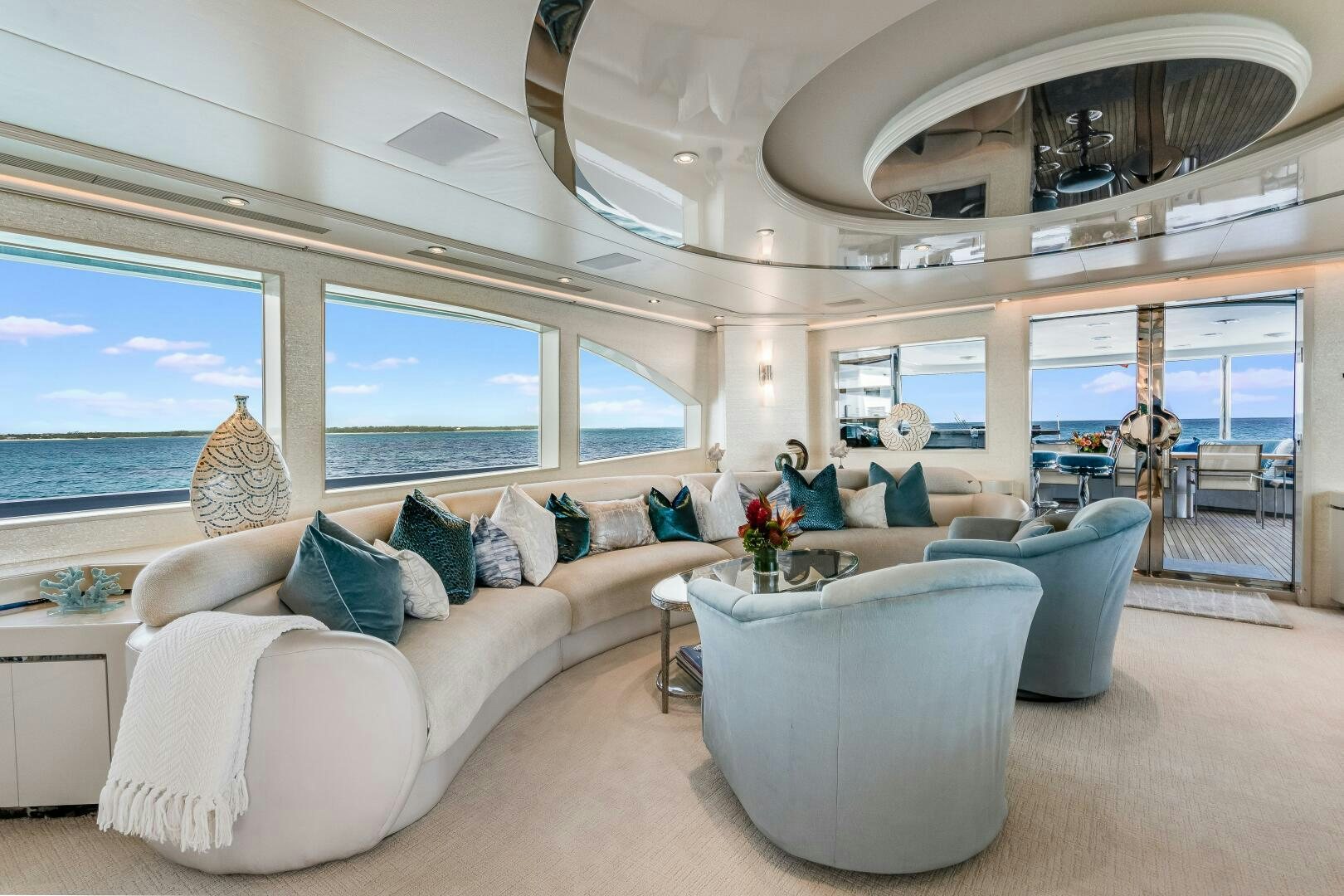 a living room with a large window aboard CUPCAKE Yacht for Sale