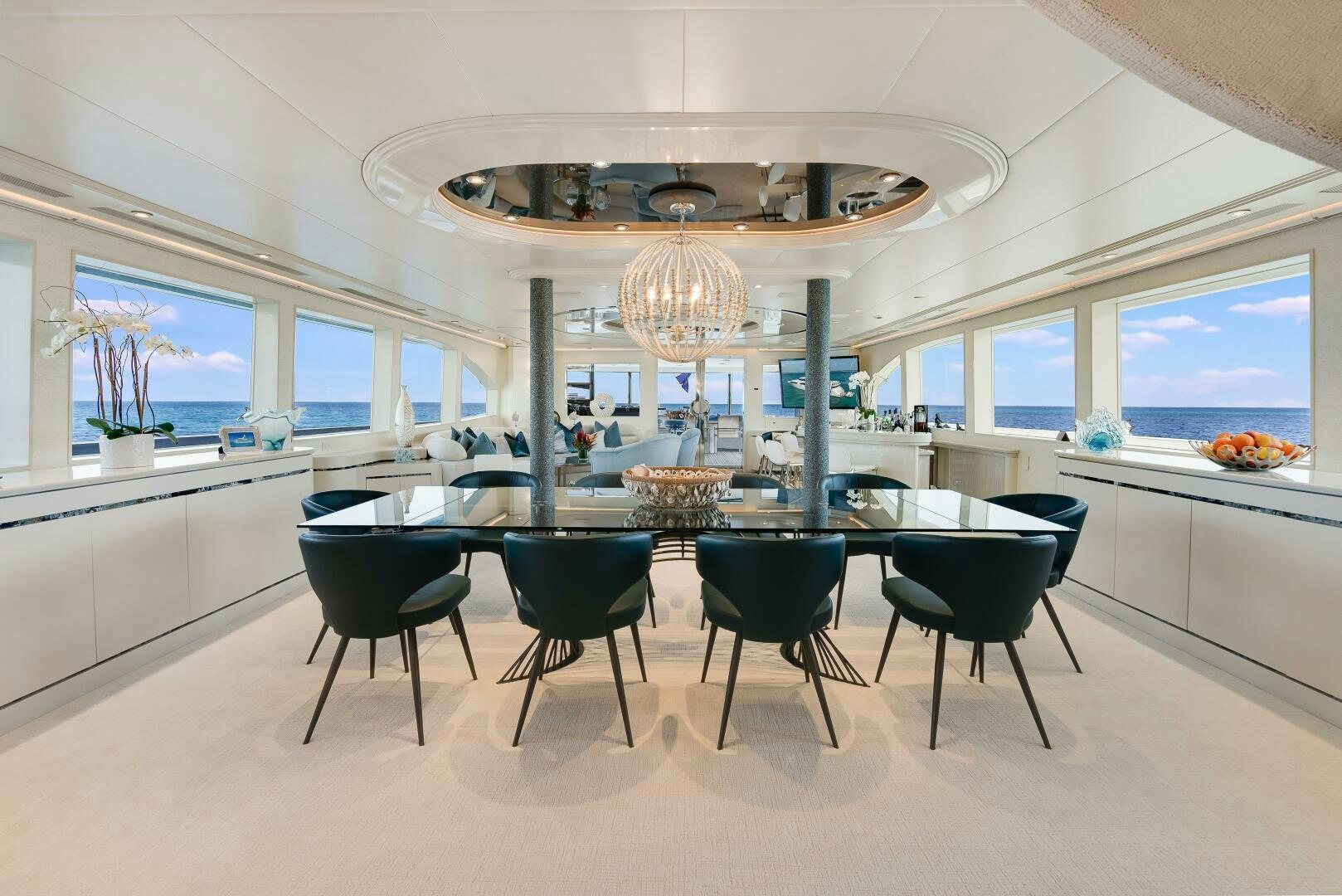 a large room with a table and chairs aboard CUPCAKE Yacht for Sale