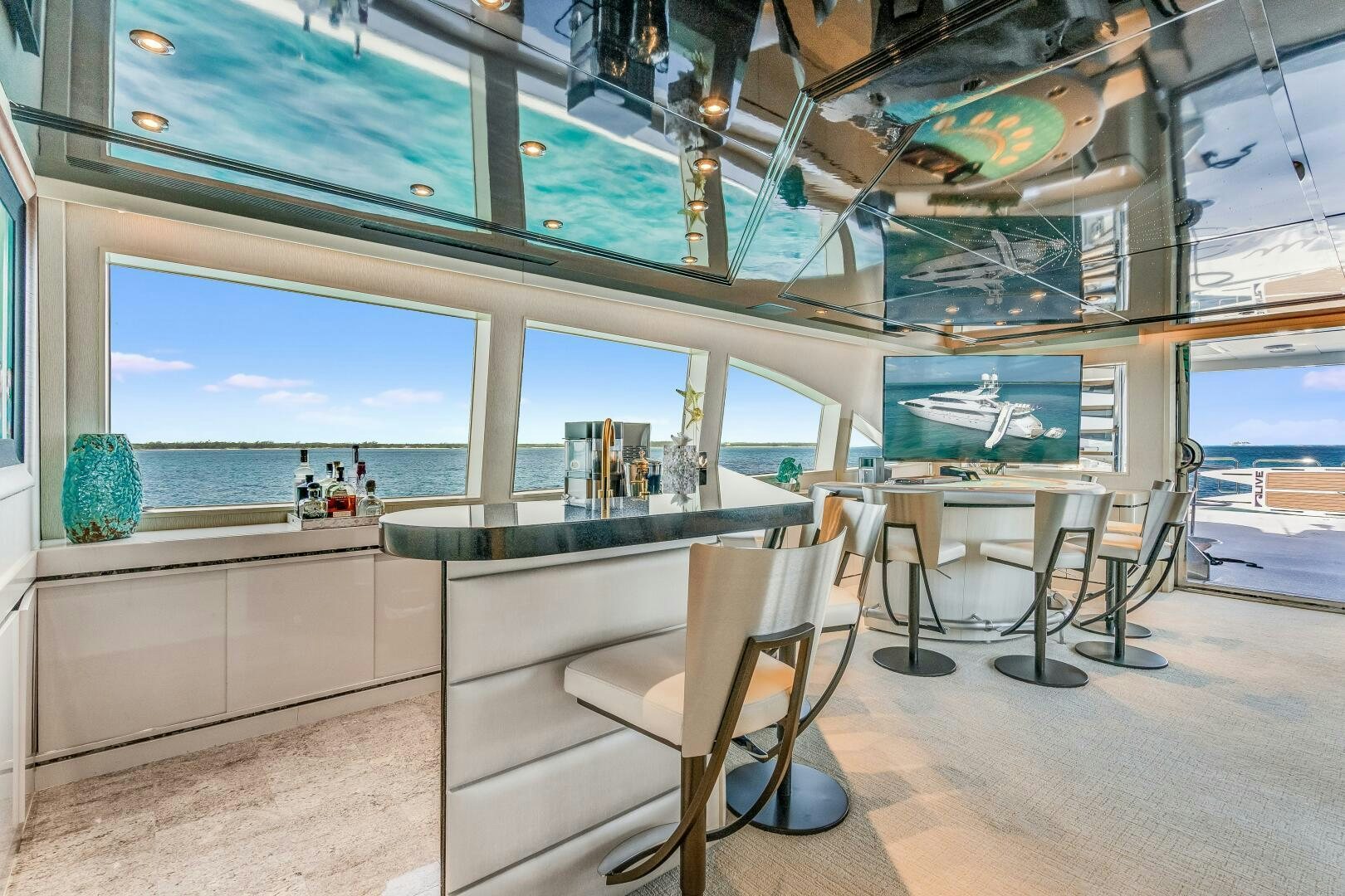 a room with a table and chairs aboard CUPCAKE Yacht for Sale