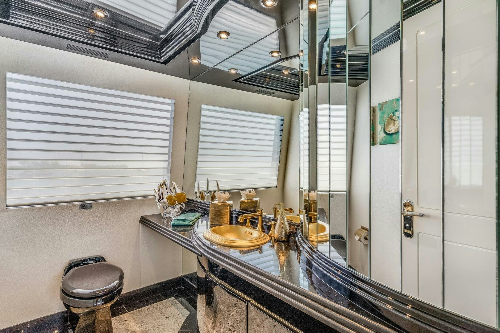 a bathroom with a sink and a shower unit aboard CUPCAKE Yacht for Sale