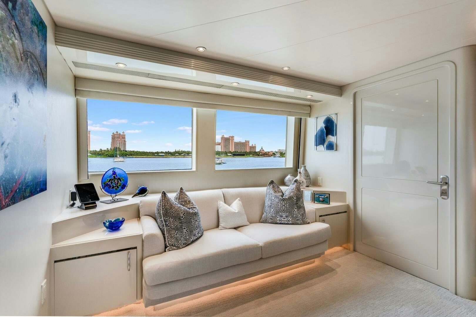a room with a couch and a window aboard CUPCAKE Yacht for Sale