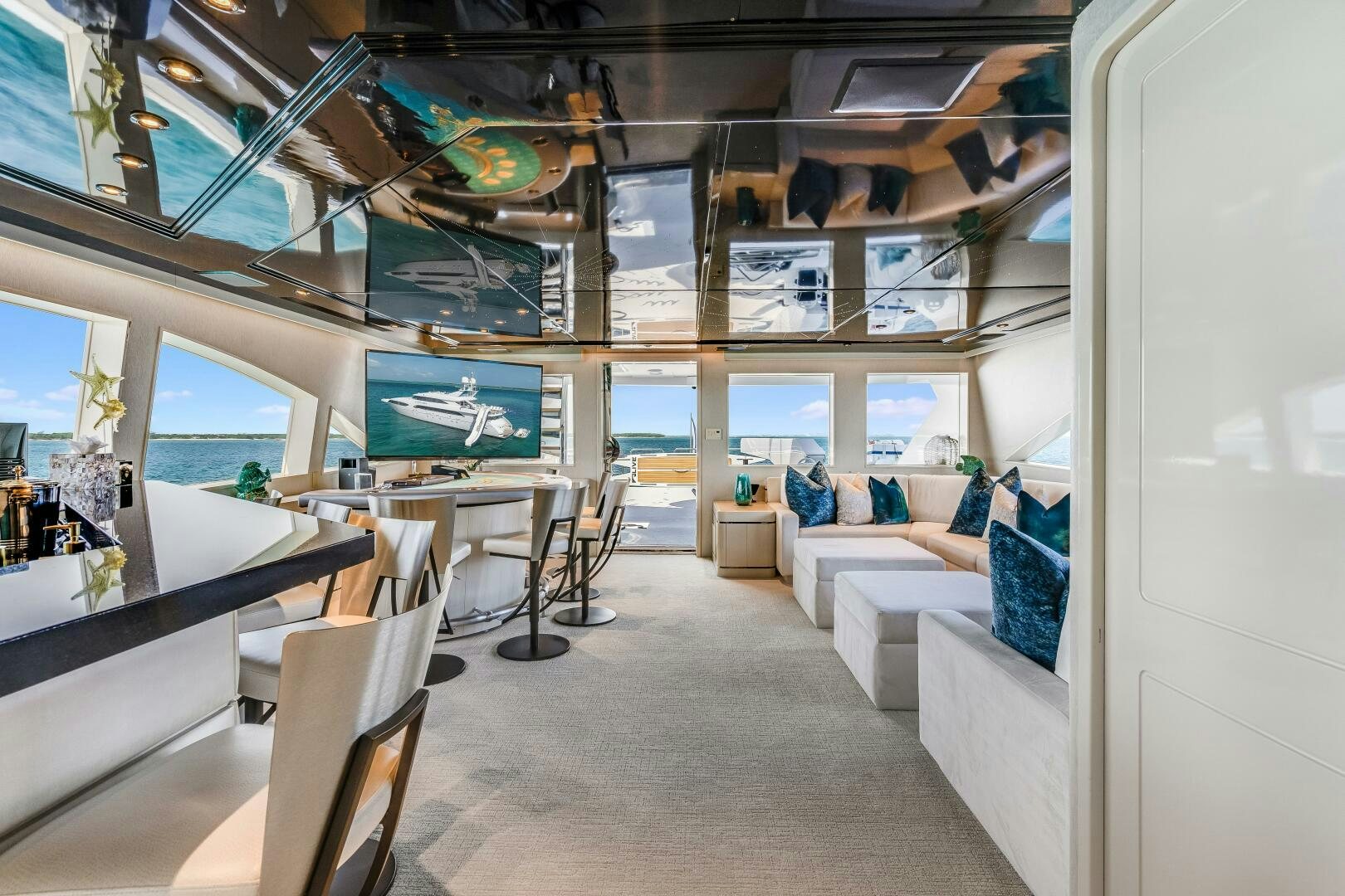 a room with a couch and a television aboard CUPCAKE Yacht for Sale
