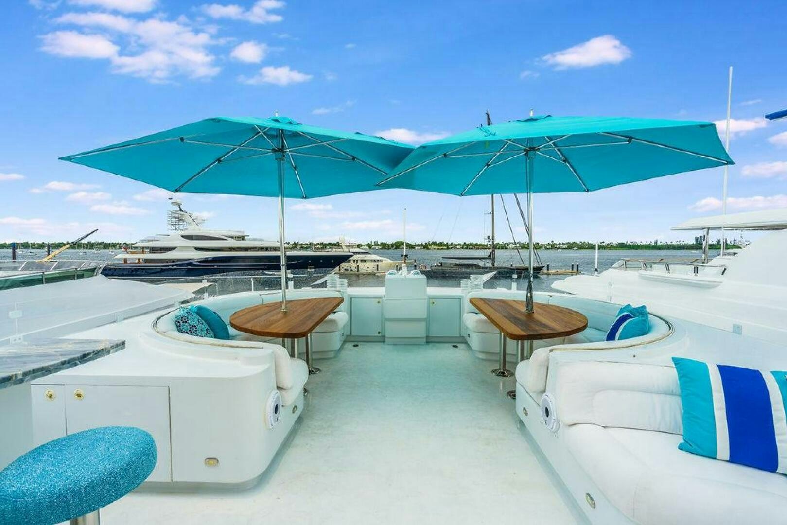 a lounge area with umbrellas aboard CUPCAKE Yacht for Sale