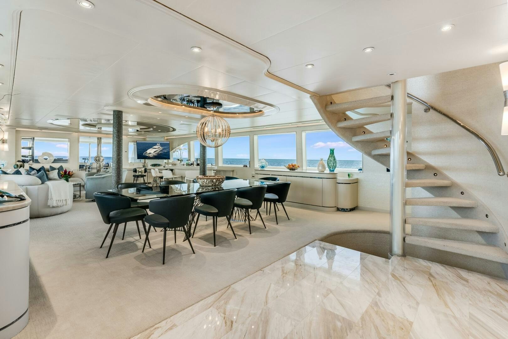 a room with a table and chairs aboard CUPCAKE Yacht for Sale