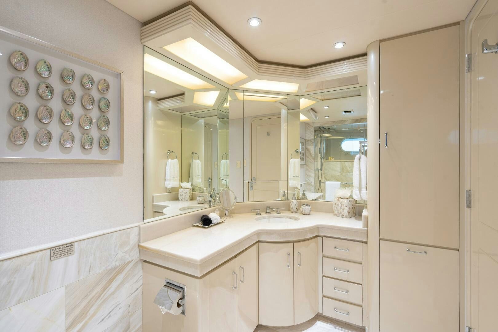 a bathroom with a large mirror aboard CUPCAKE Yacht for Sale