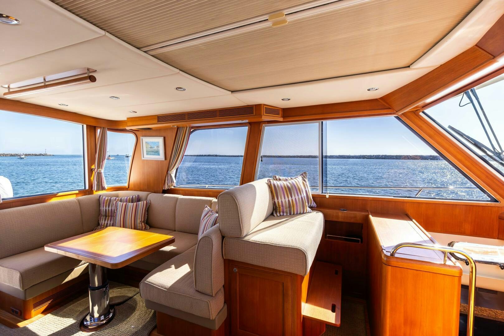 a living room with a large body of water aboard FINALLY US Yacht for Sale