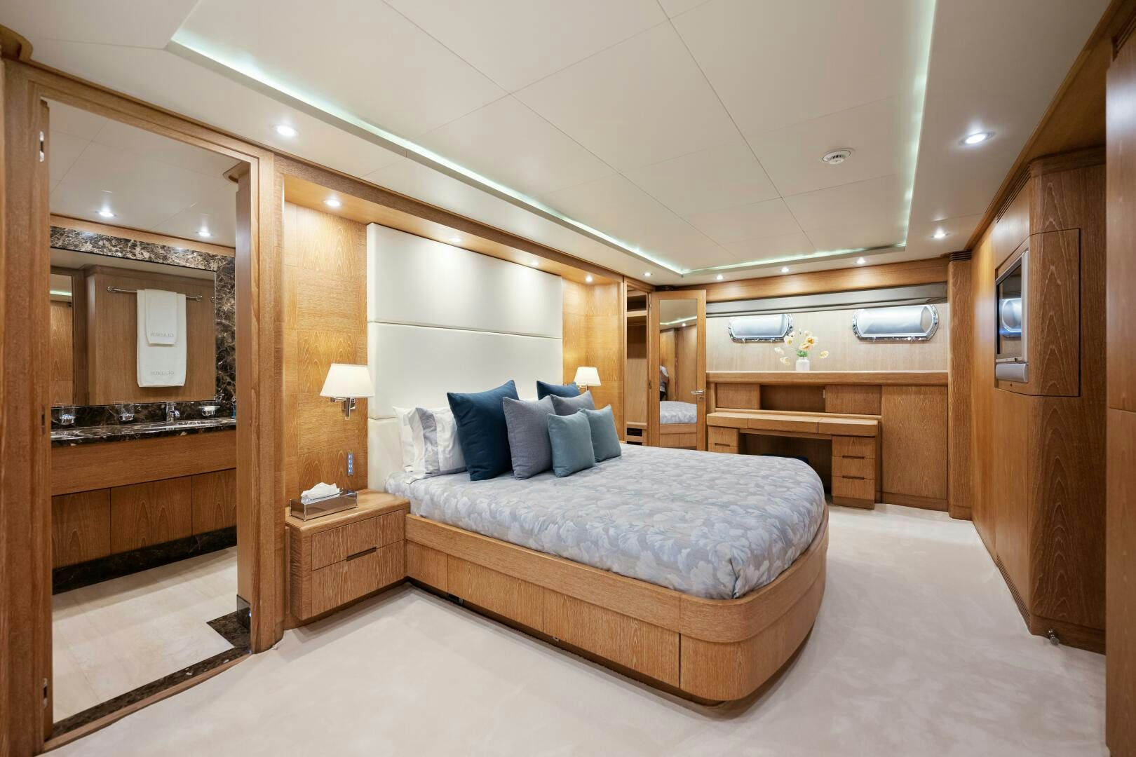 a large bedroom with a bed aboard GLADIUS Yacht for Sale