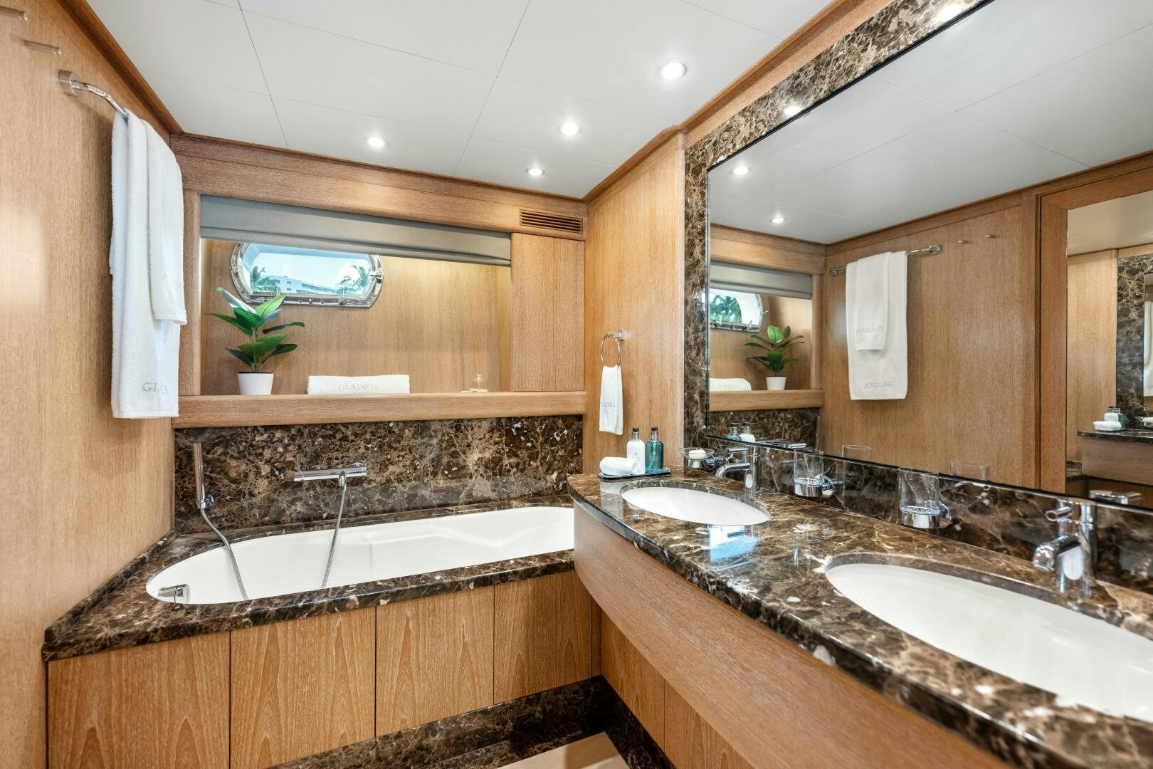 a bathroom with a large mirror aboard GLADIUS Yacht for Sale